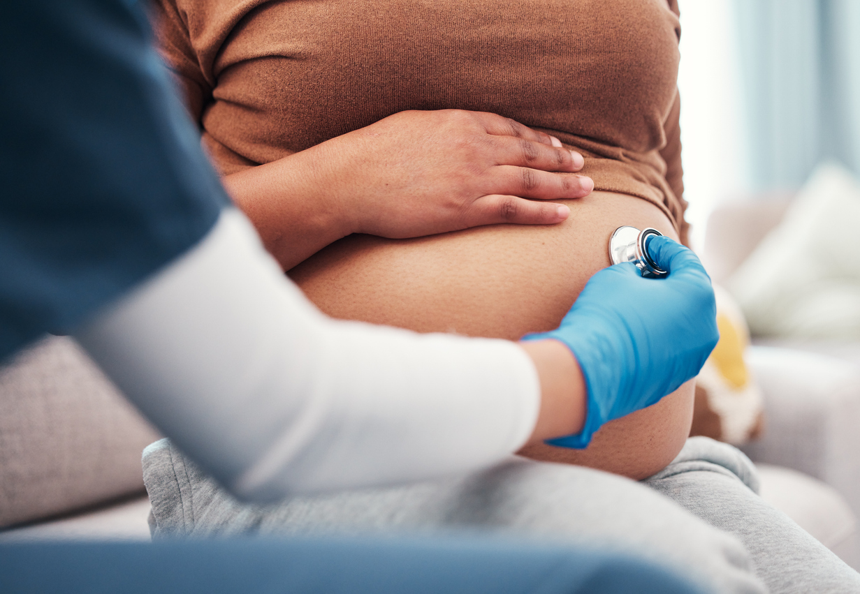 Pregnant woman at checkup with doctor
