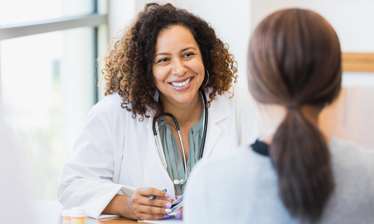 Caring doctor listens to patient