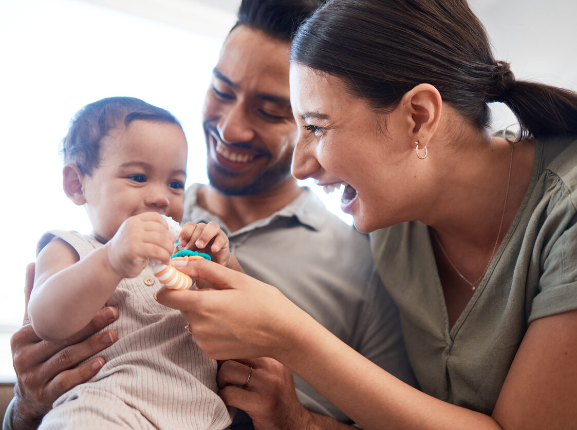 Shot of a young couple bonding with their baby girl on a sofa at home