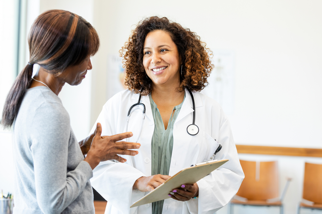 Female doctor and patient talking