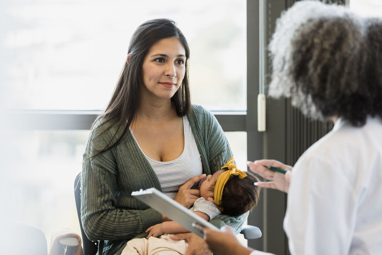Mother and Baby Consultation with Doctor at Clinic