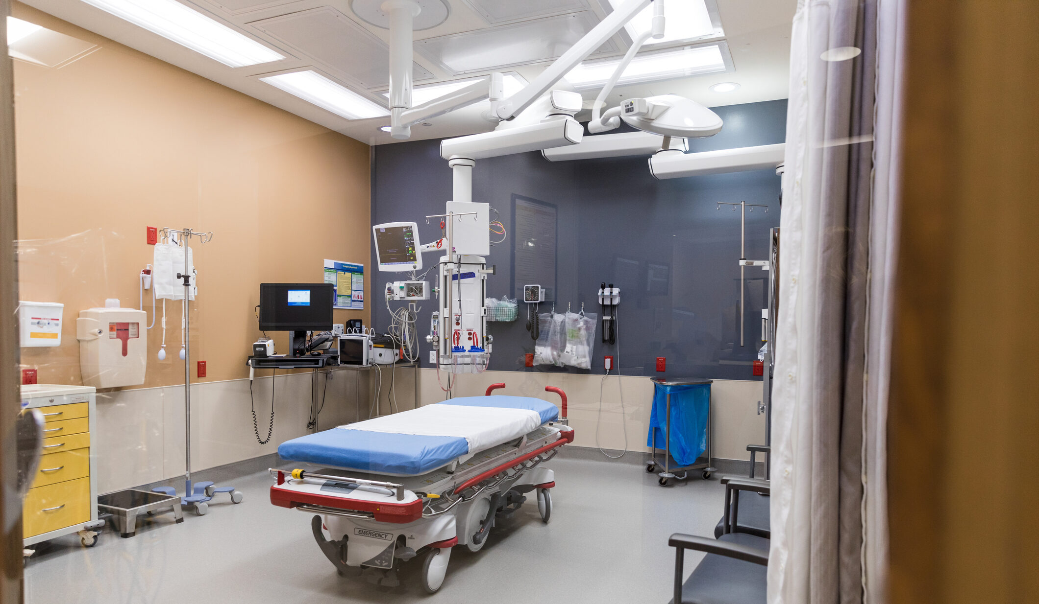Hospital room with medical equipment and technology. Clean, sterile environment.