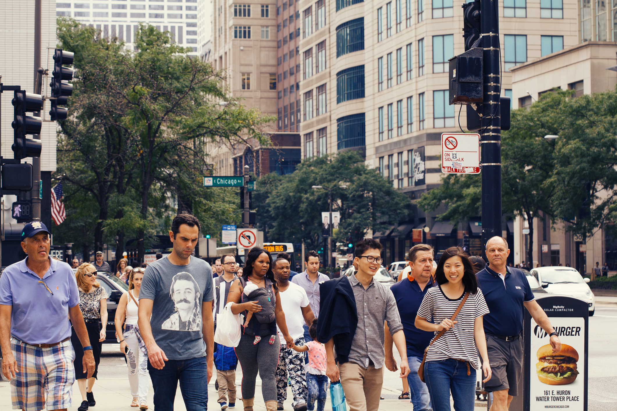 Chicago, IL, United States - September 16, 2016: Commuters crossing the street at rush hour in Chicago.